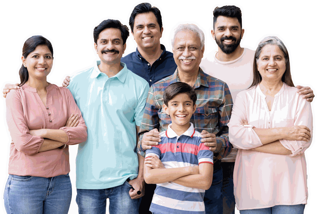 A multi-generational Indian family — parents, grandparents, and child — standing together